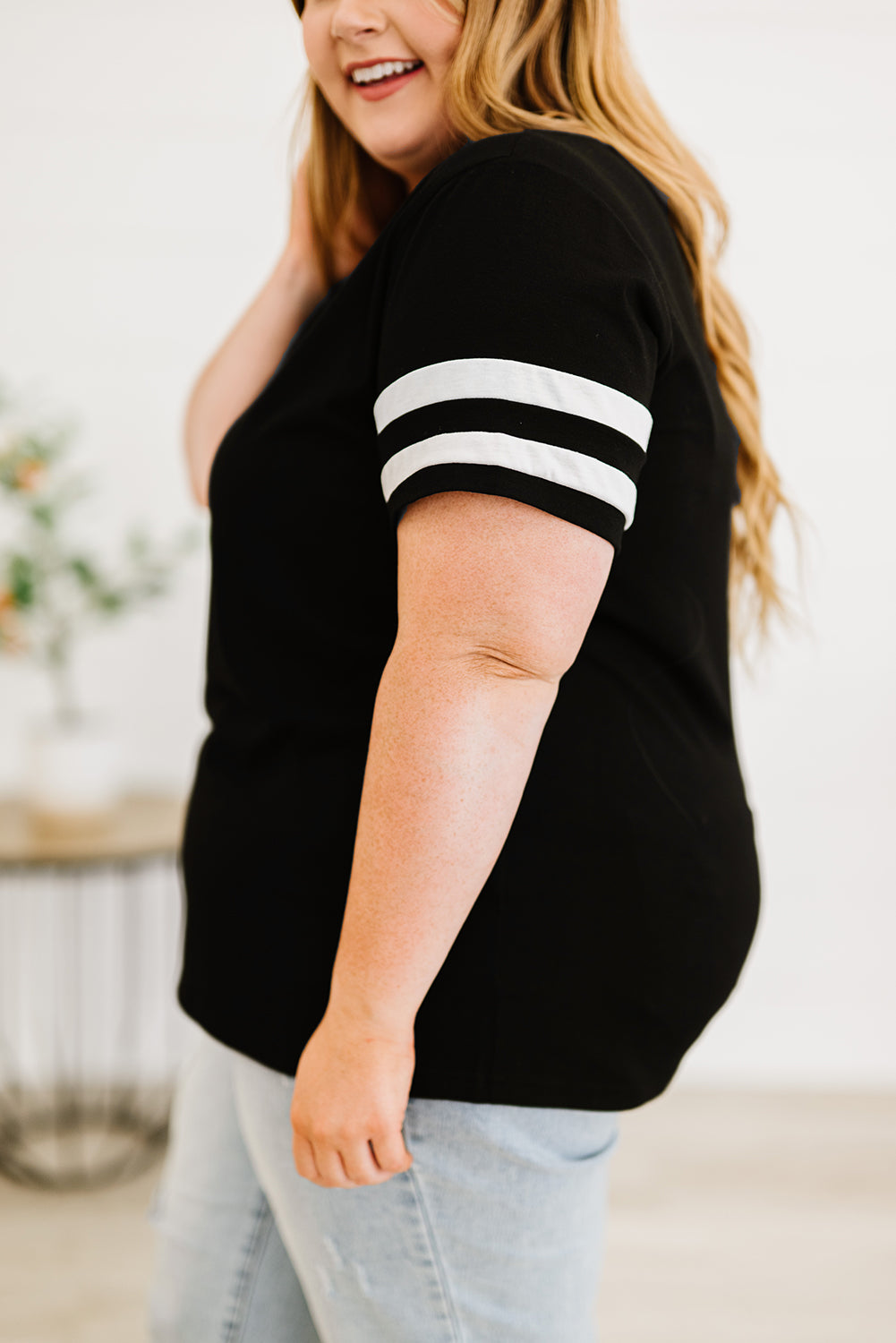 Chic black plus size V-neck tee with striped sleeves