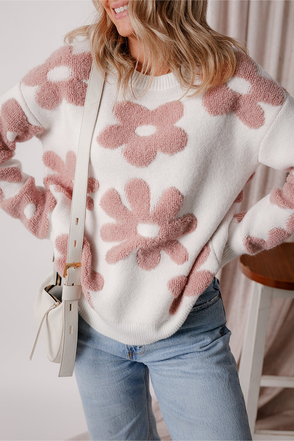 Floral-inspired white drop shoulder sweater for relaxed winter vibes