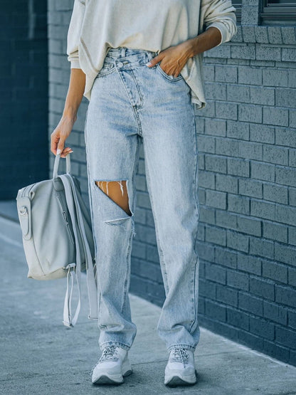 Distressed Asymmetric Waist Jeans.