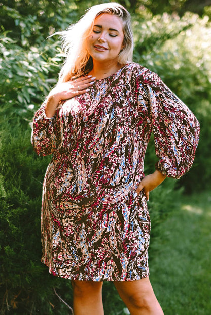 Plus Size Printed Round Neck Long Sleeve Mini Dress.