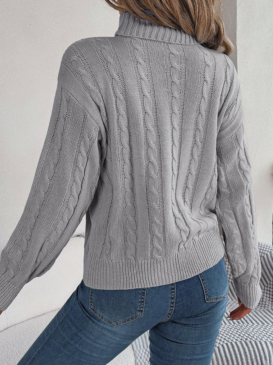 Cable-Knit Turtleneck Dropped Shoulder Sweater.