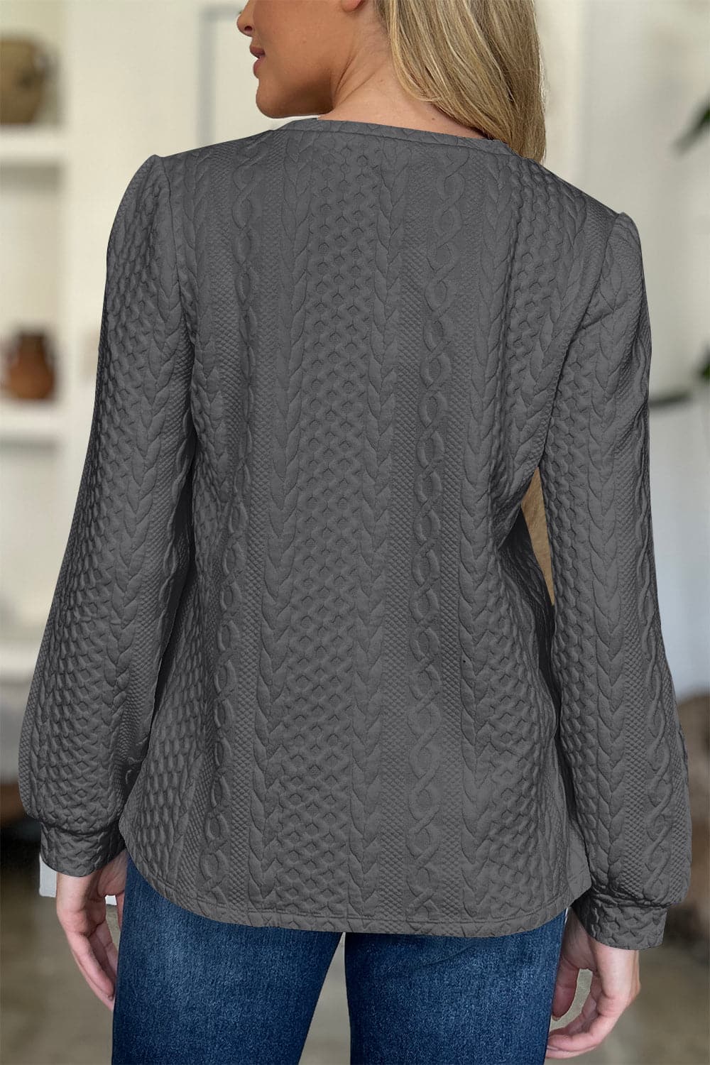 Textured Round Neck Long Sleeve Sweatshirt.