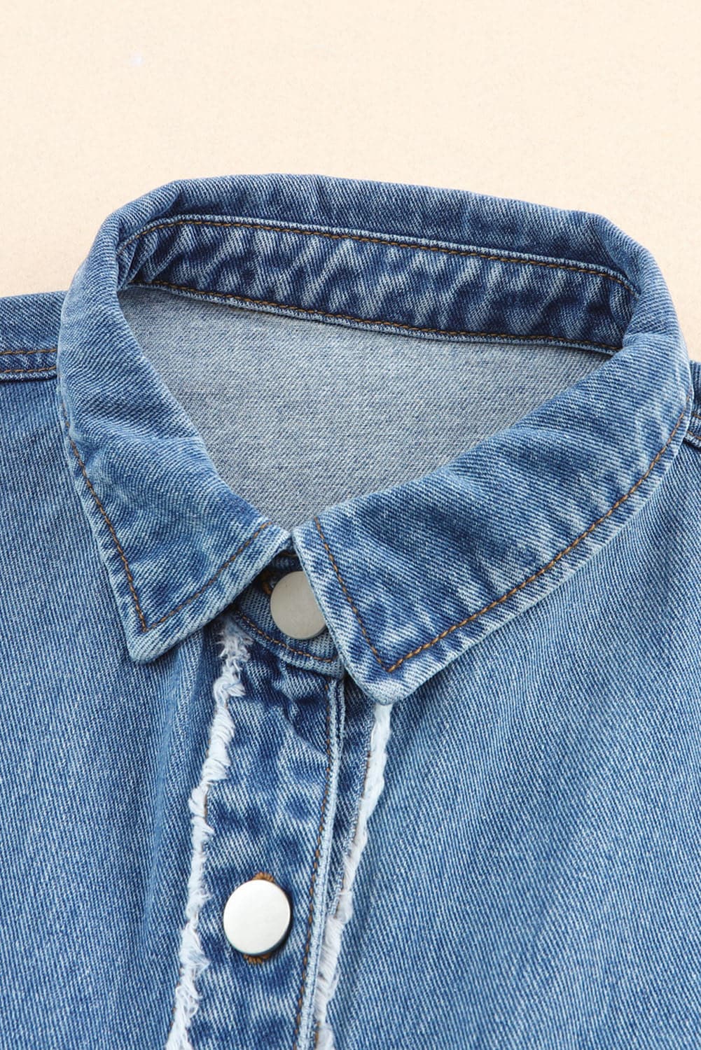 Raw Hem Button Up Denim Jacket with Breast Pockets.