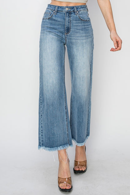 RISEN Raw Hem Cropped Wide Leg JeansHigh Rise Raw Hem Cropped Wide Leg Jeans are the perfect addition to your wardrobe. With their high rise fit, raw hem detail, and wide leg silhouette, these jeans ofLove Salve RISEN Raw Hem Cropped Wide Leg JeansJeans