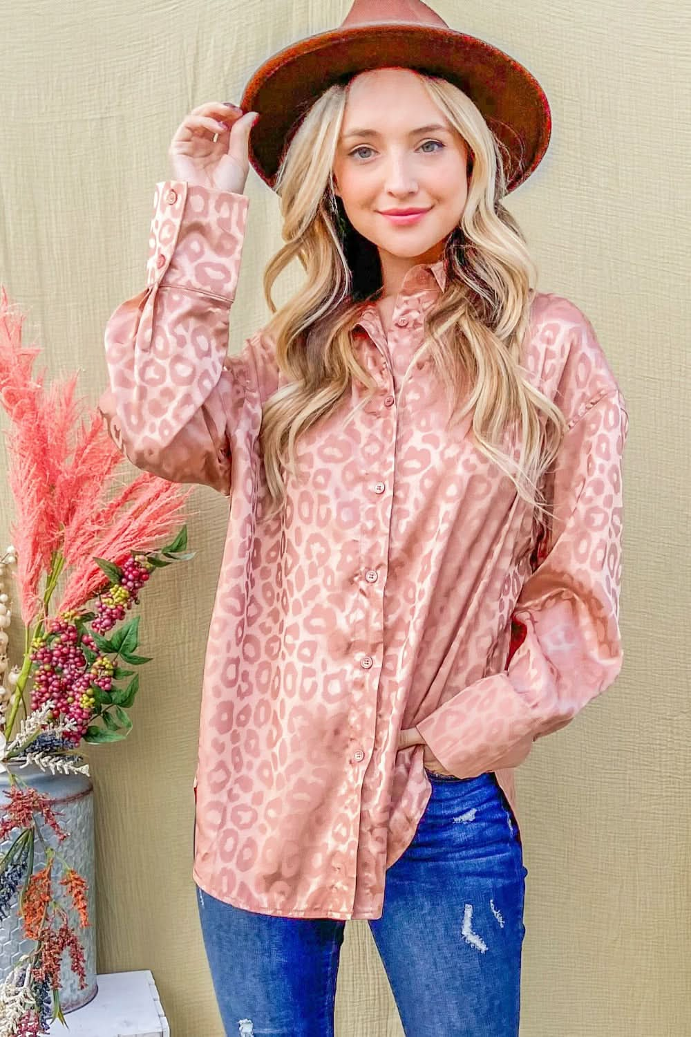 Satin leopard print button-up shirt with a flattering curved hem