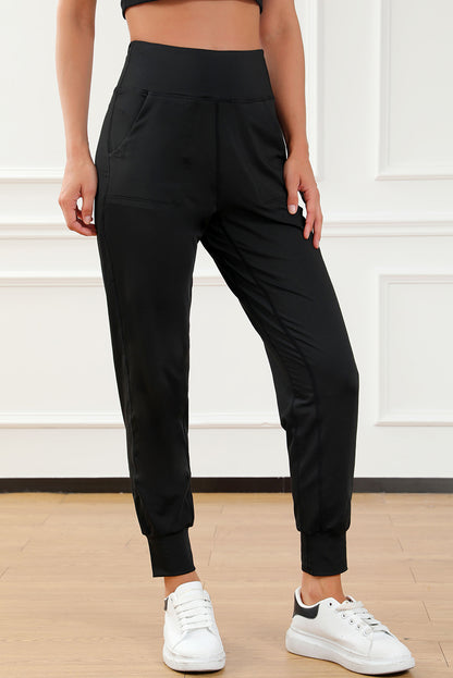 Modern high-waisted joggers with exposed seams and pockets