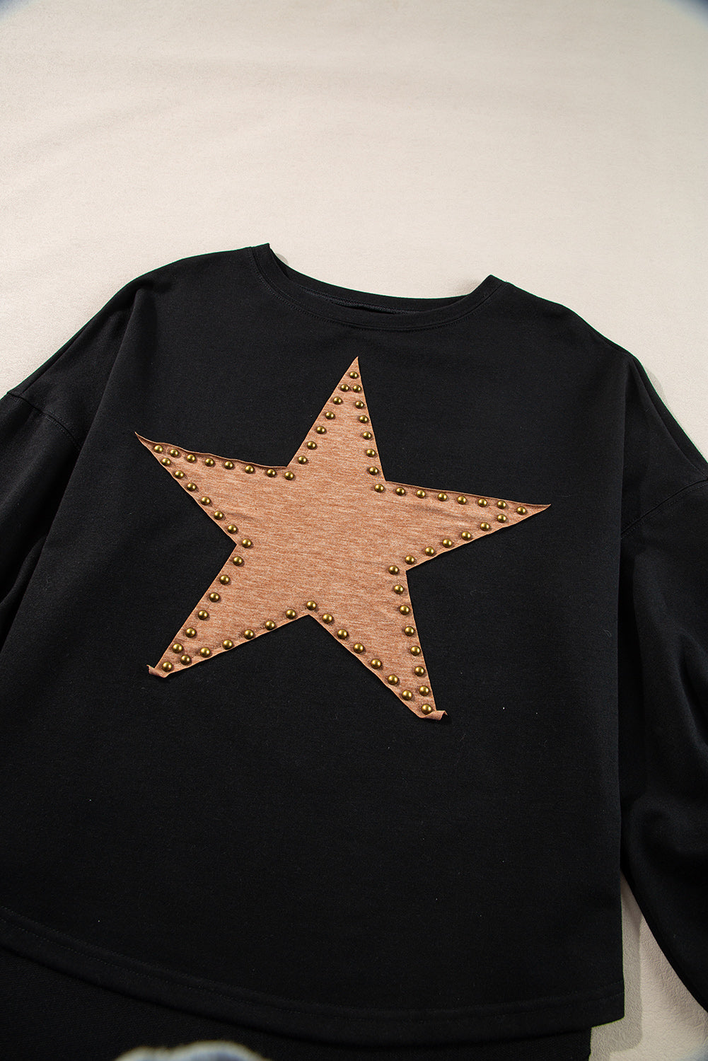 Black oversized studded star top