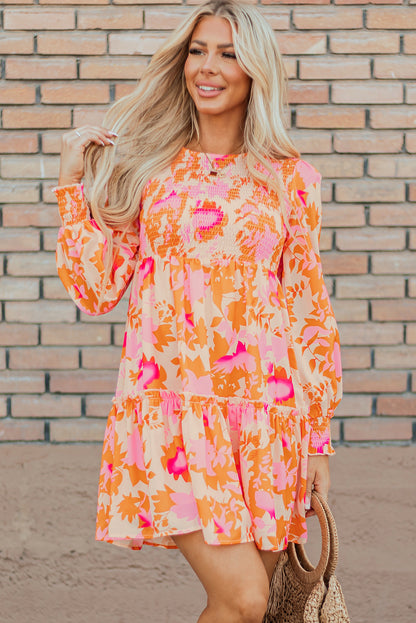 Eye-catching orange abstract smocked mini dress with ruffled lantern sleeves