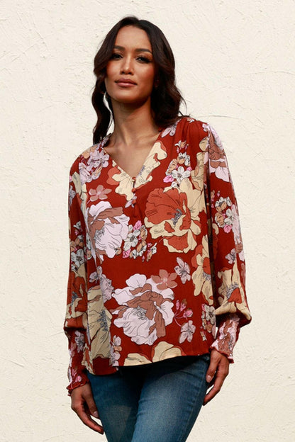 Floral V-Neck Smocked Lantern Sleeve BlouseExperience Effortless Elegance with our Floral V-Neck Smocked Lantern Sleeve Blouse
 Indulge in the beauty of our Floral V-Neck Smocked Lantern Sleeve Blouse, a versLove Salve -Neck Smocked Lantern Sleeve BlouseBlouses