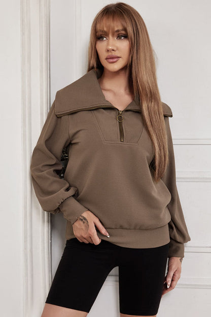 Pocketed Quarter Zip Collared Neck Sweatshirt.