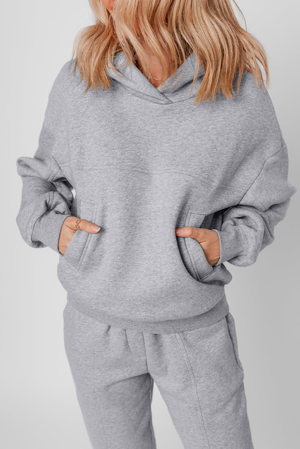 Stylish gray hoodie and joggers set with exposed seams