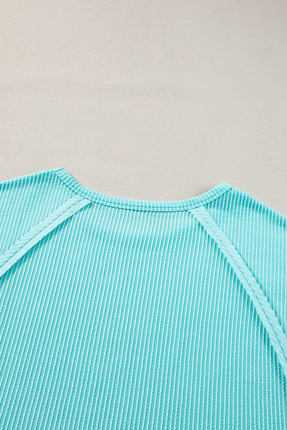 Light blue ribbed t-shirt with exposed seams for plus size comfort