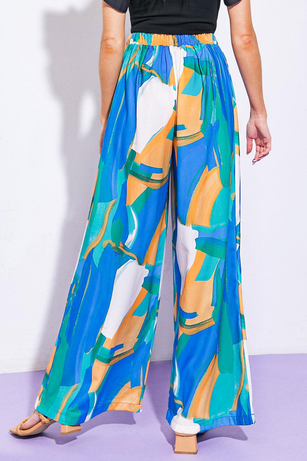 Flying Tomato DEVOTED LOVER WOVEN PANTS, side profile showcasing the relaxed fit and soft woven fabric texture.