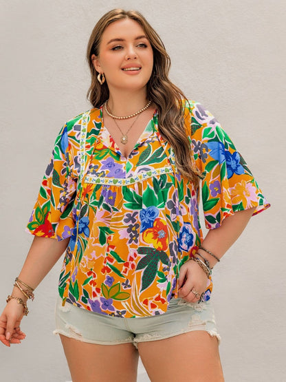 Plus Size Printed Tie Neck Half Sleeve Blouse.