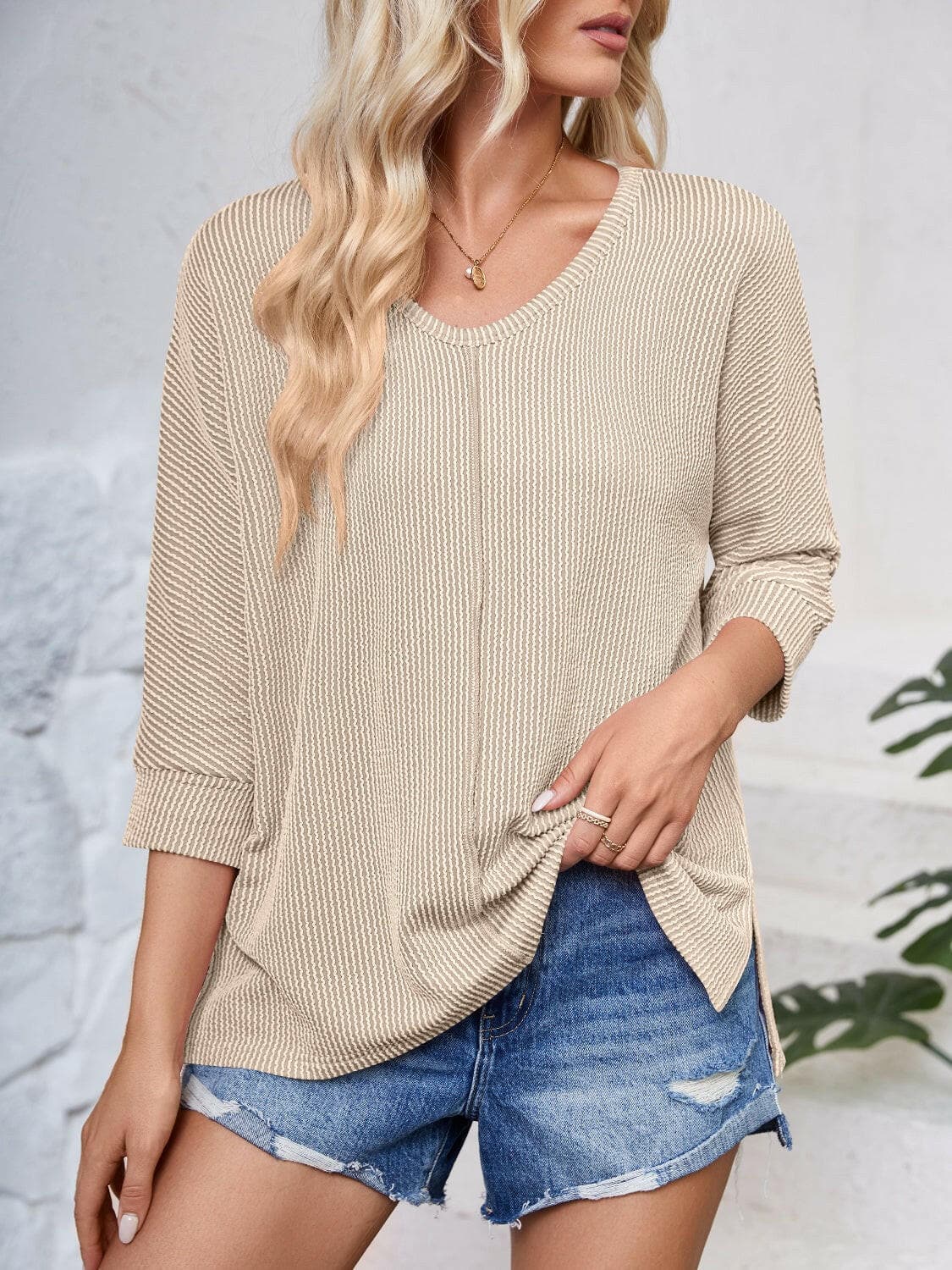 Textured Round Neck Three-Quarter Sleeve Blouse.