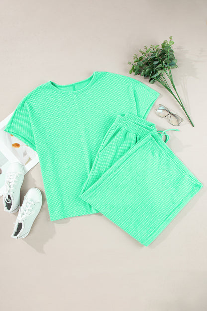 Chic mint green plus size batwing sleeve tee and wide-leg pants ensemble