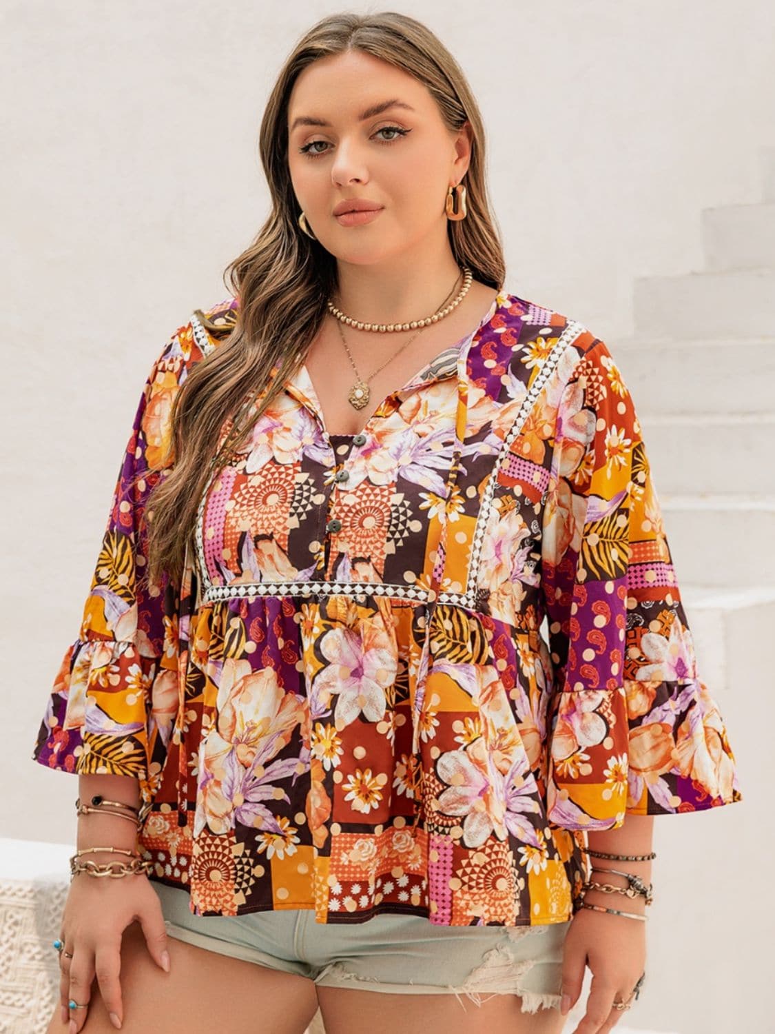 Plus Size Printed Tie Neck Blouse.