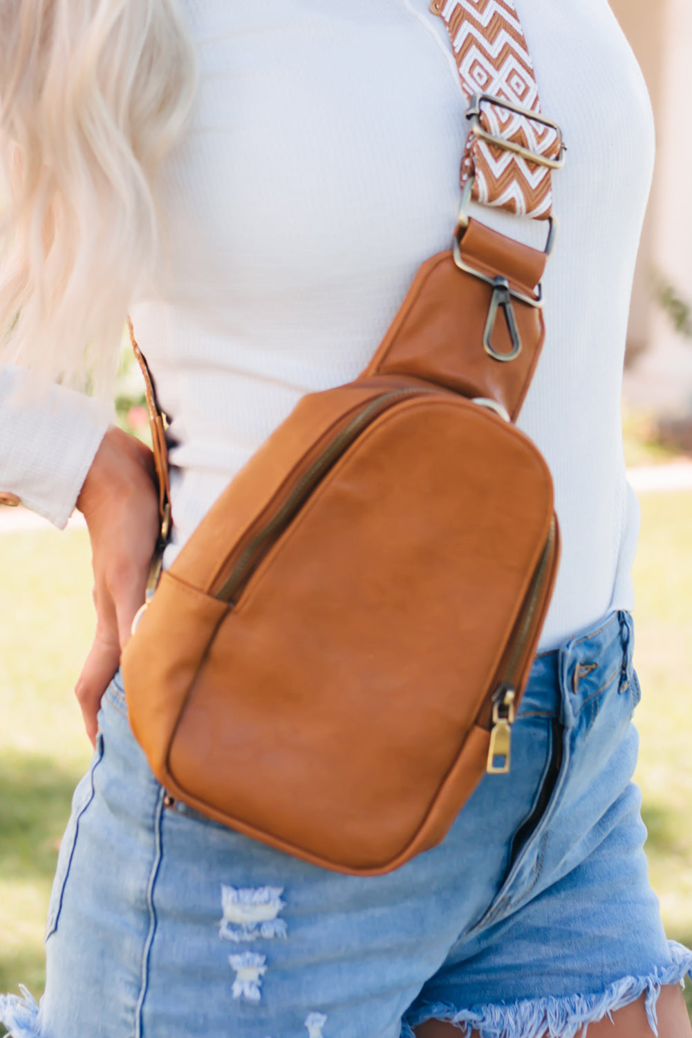 Stylish brown faux leather crossbody bag with secure zip closure