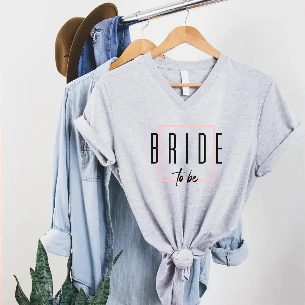 Side view of a model in the Adorb.co bachelorette V-neck T-shirt, highlighting the sleeve length and relaxed side seam.