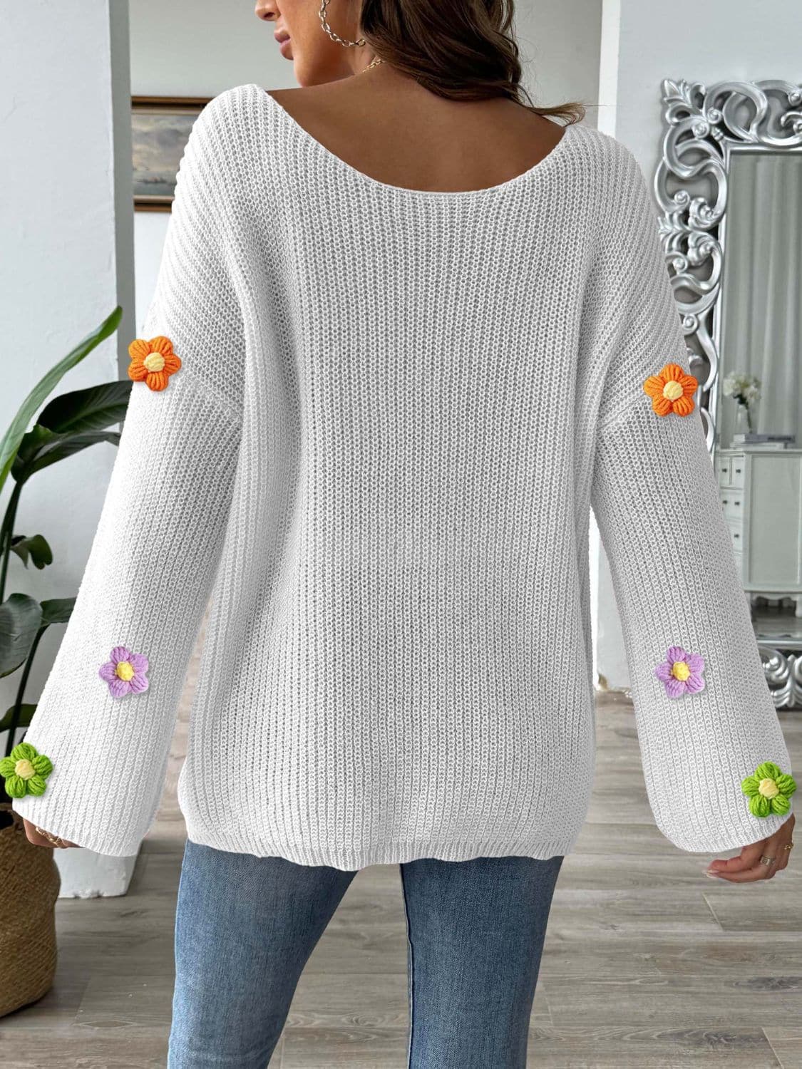 Floral print long sleeve sweater with a round neck