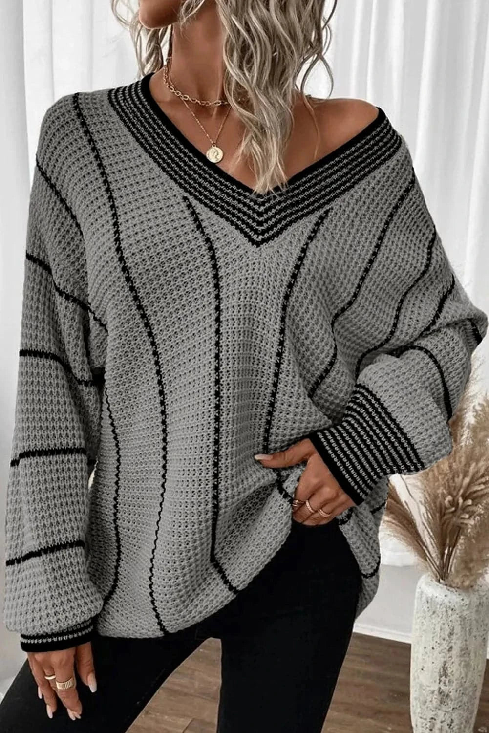 Vibrant striped v-neck sweater with dropped shoulders