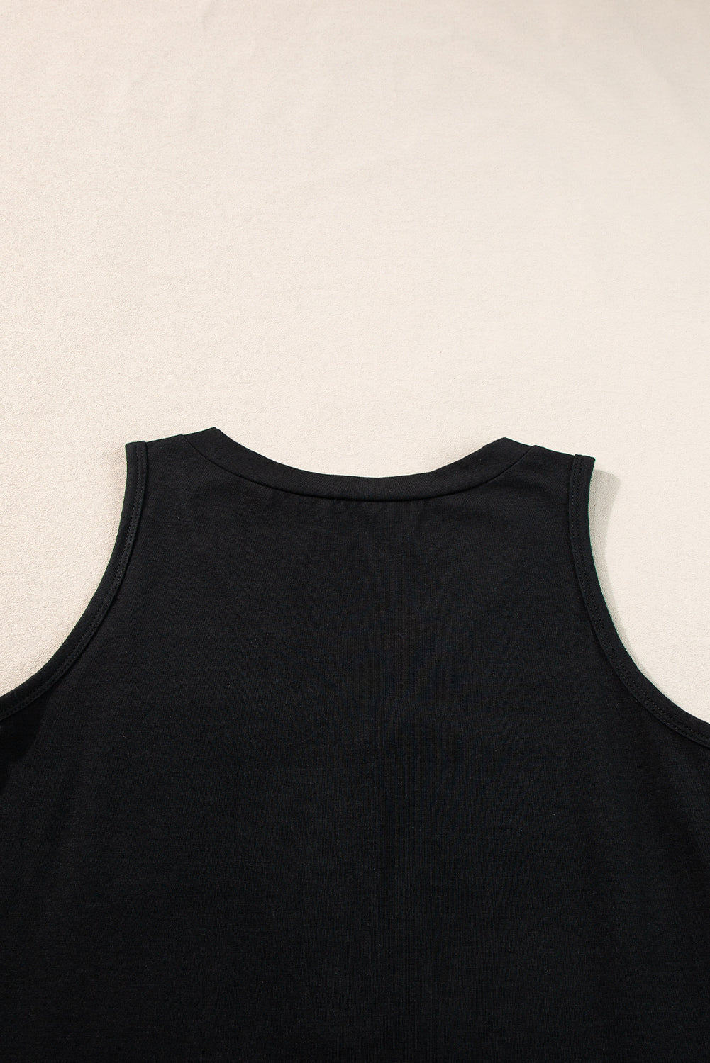 Chic black v-neck tank top with half buttons and patched pocket