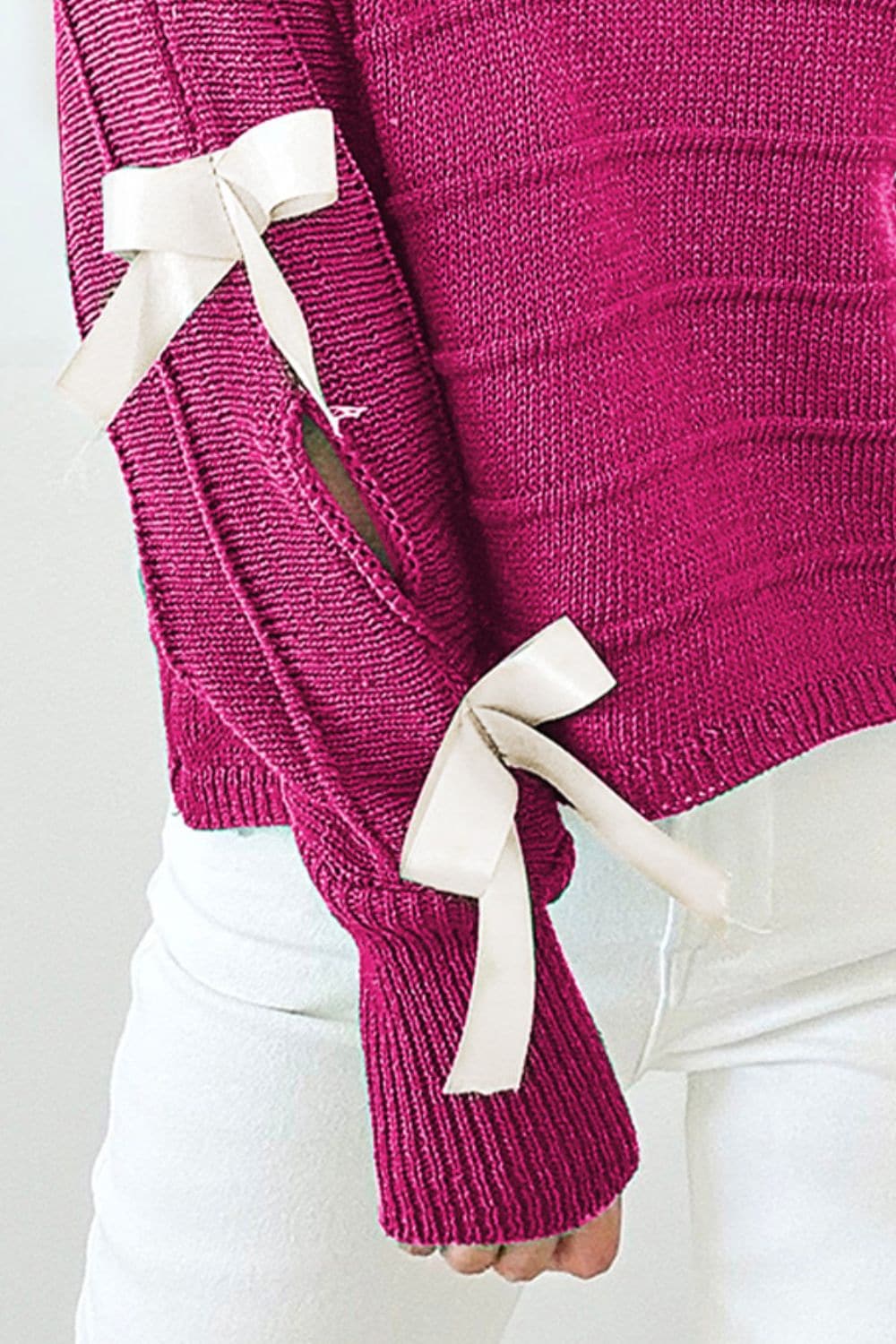 Bow Cutout Round Neck Long Sleeve Knit Top.