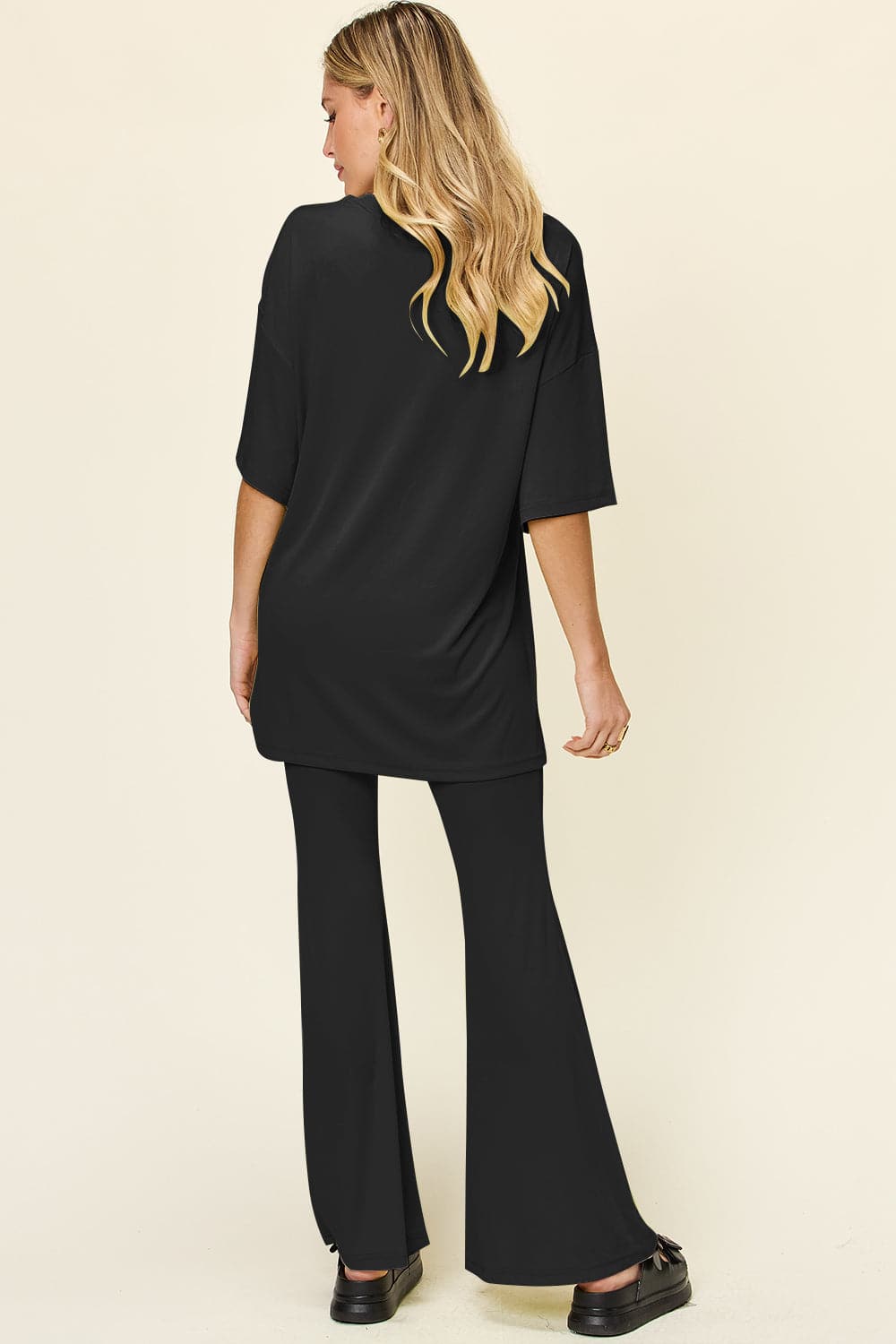 Double Take Full Size Round Neck Drop Shoulder T-Shirt and Flare Pants Set.