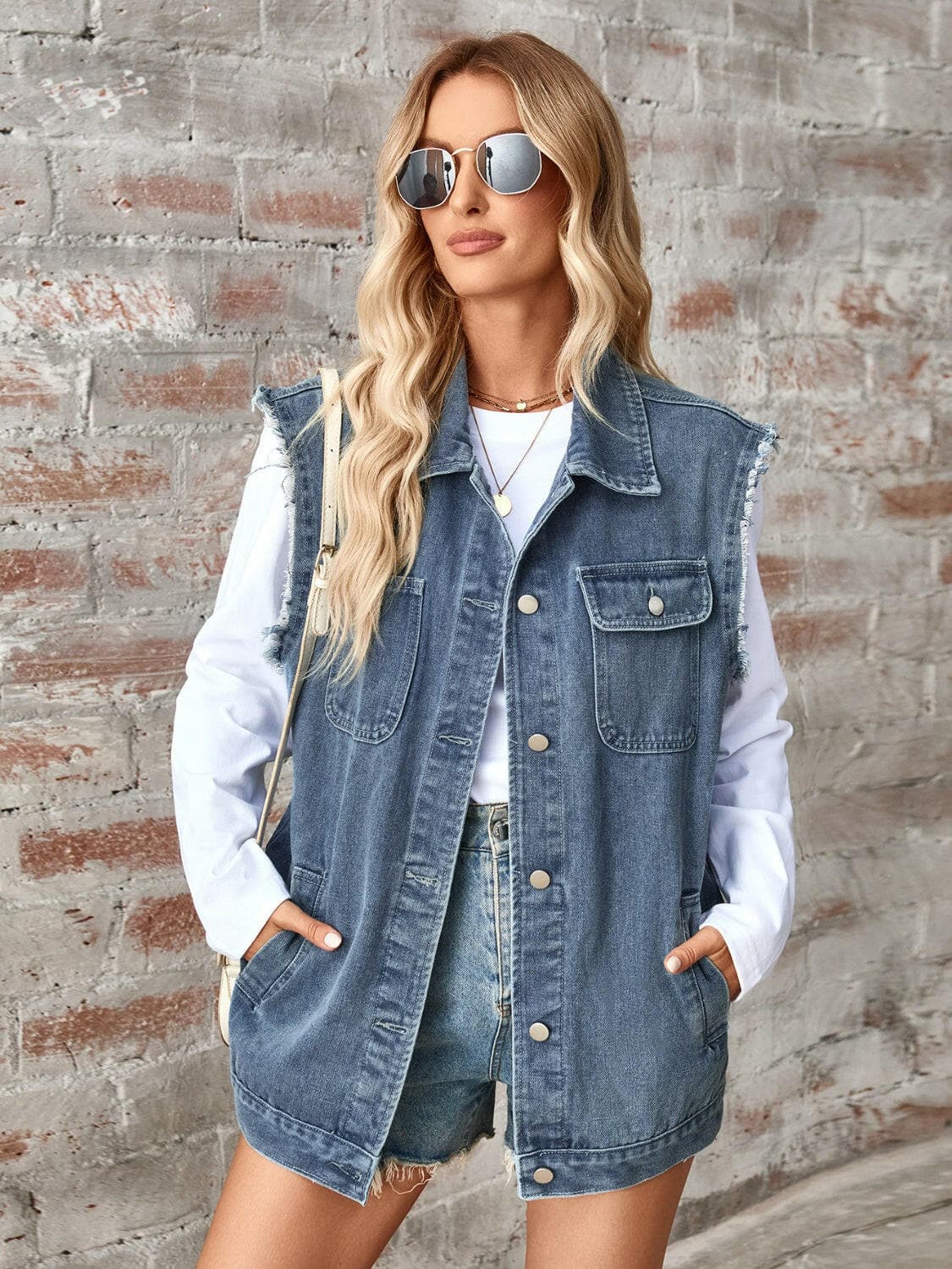 Raw Hem Sleeveless Button Up Denim Jacket.