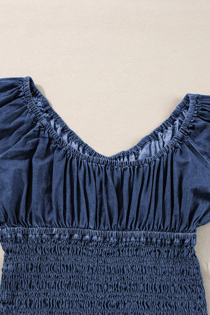 Chic dark blue ruffled puff sleeve denim blouse with smocked details