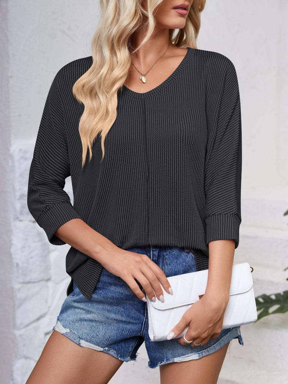 Textured Round Neck Three-Quarter Sleeve Blouse.