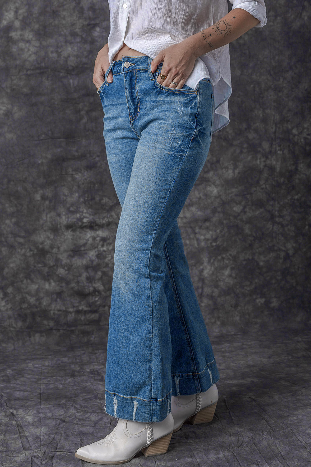 Chic light blue distressed flare jeans for a trendy look