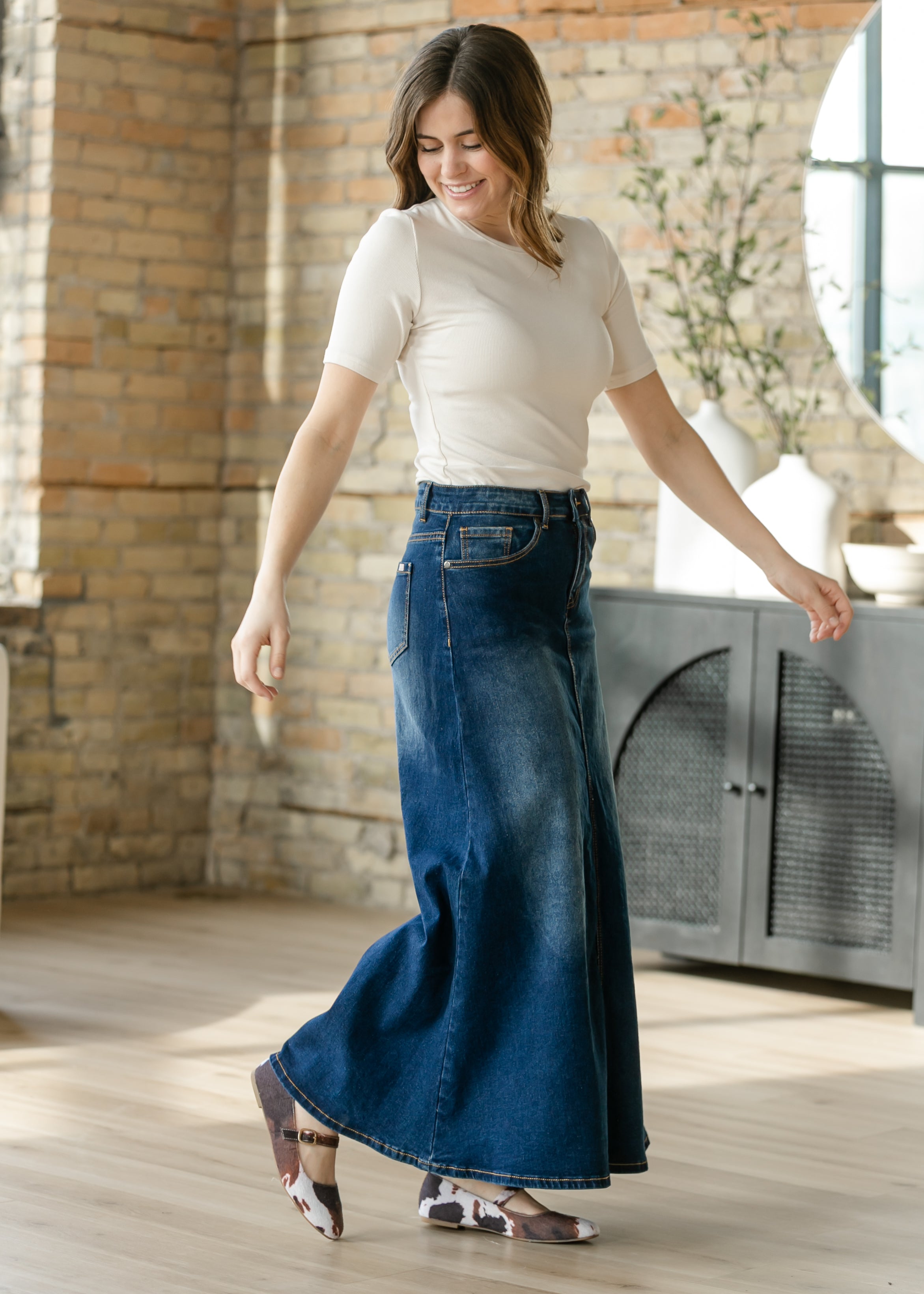Inherit Co. Bethany Dark Wash A-line Long Denim Skirt, styled for an active day, offering comfort and timeless appeal.
