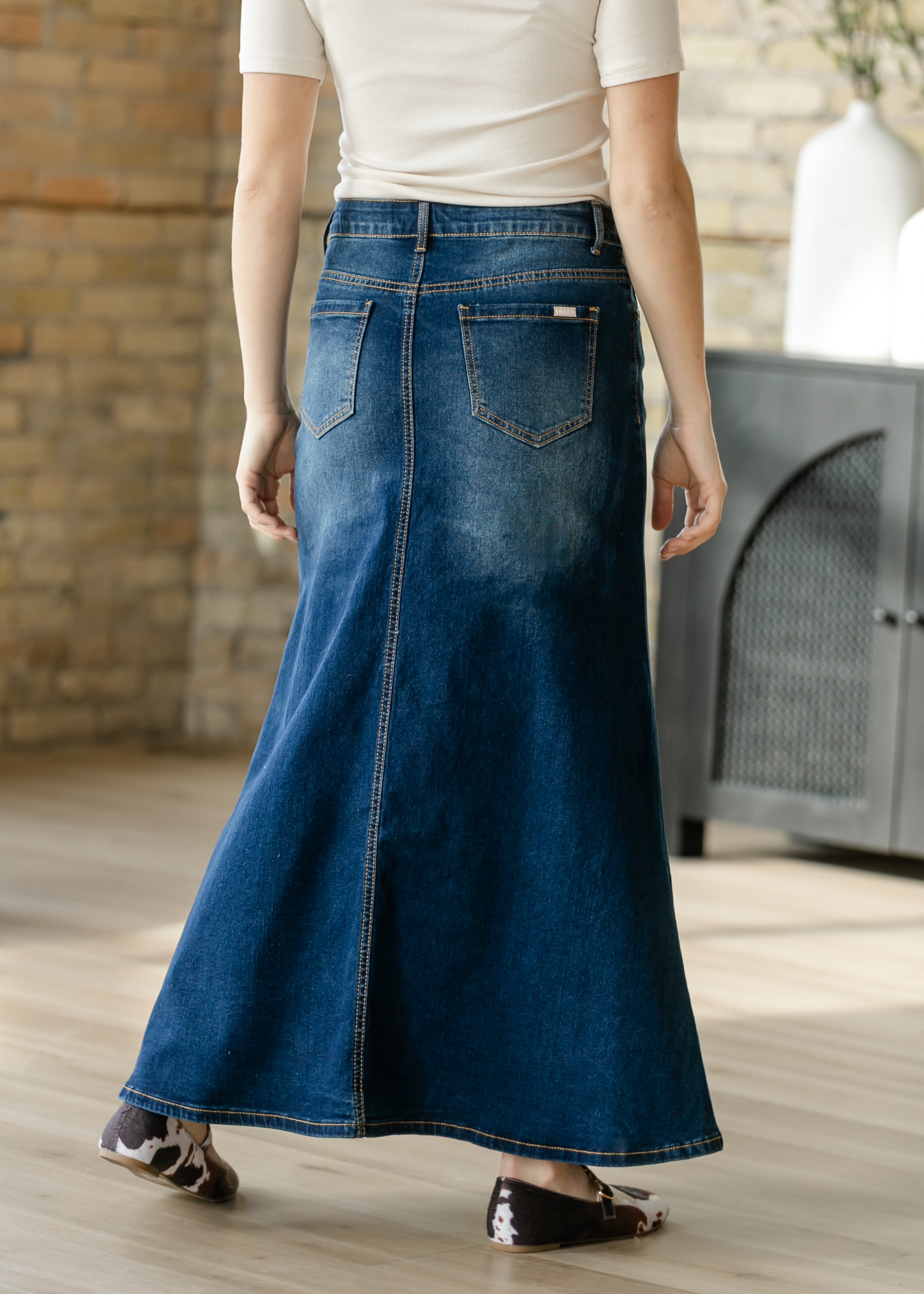 Inherit Co. Bethany Dark Wash A-line Long Denim Skirt paired with a blouse, illustrating its versatile styling options.