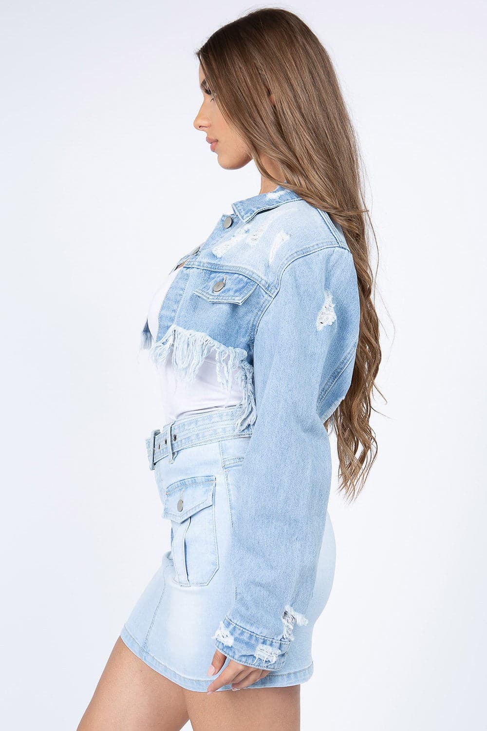 Chic cropped distressed denim jacket with stylish frayed hem