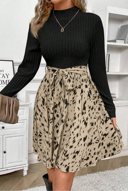 Chic black ribbed knit belted A-line dress with trendy patchwork print