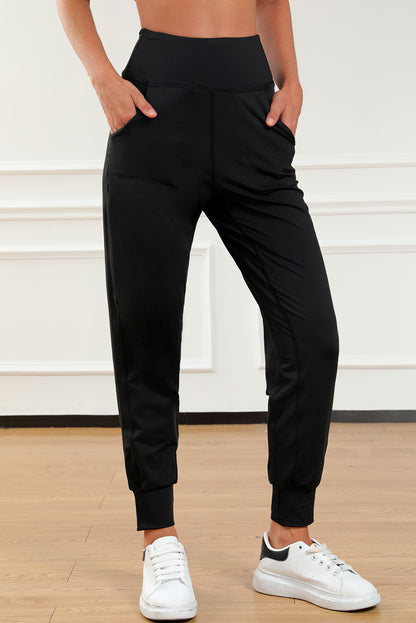 Modern high-waisted joggers with exposed seams and pockets