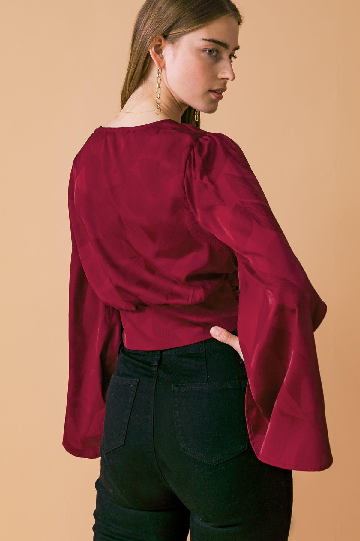 Fabric detail of Flying Tomato THE RIGHT ADDITION WOVEN TOP, highlighting the quality and feel of the woven material.