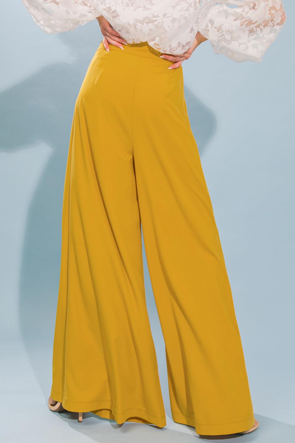 Flying Tomato LOVE AND BEYOND WOVEN PANTS on a model, highlighting the comfortable fit and elegant drape. Quality apparel fro
