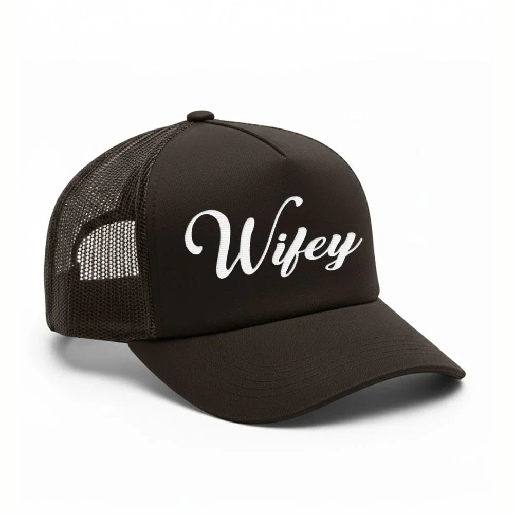 A woman enjoying a sunny day in her Adorb.co Wifey trucker hat, a fun and practical newlywed or anniversary gift.