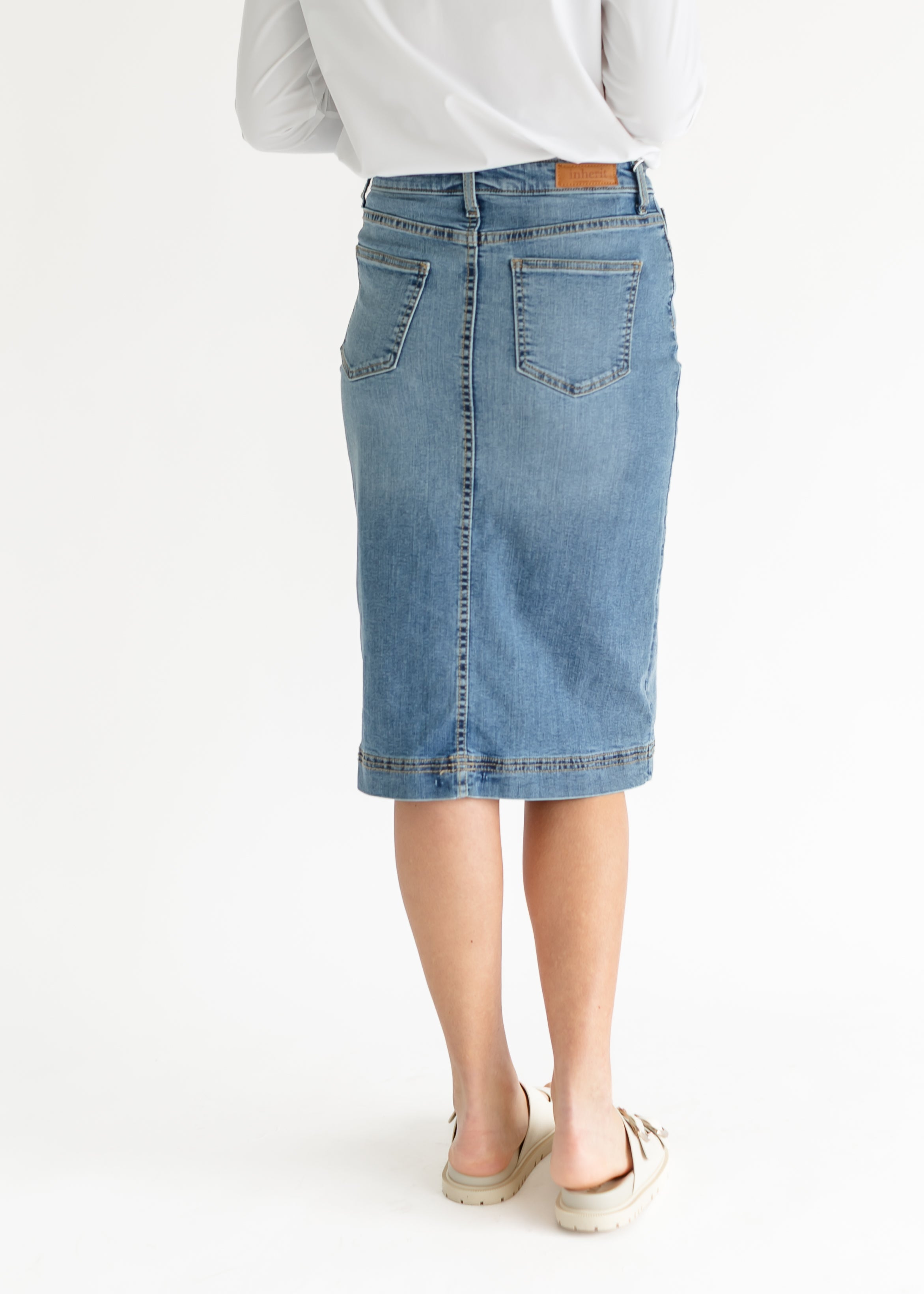 Inside view of the Inherit Co. Bryn Light Wash Denim Midi Skirt, showcasing the quality cotton blend fabric.