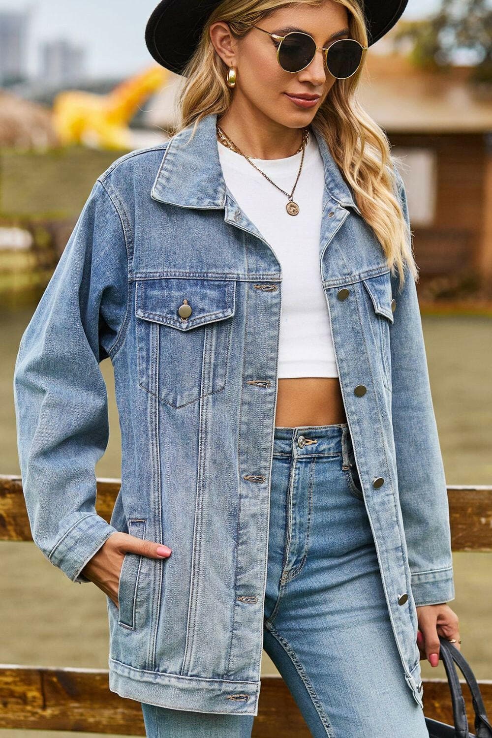 Chic denim jacket with buttoned collared neckline and pockets.