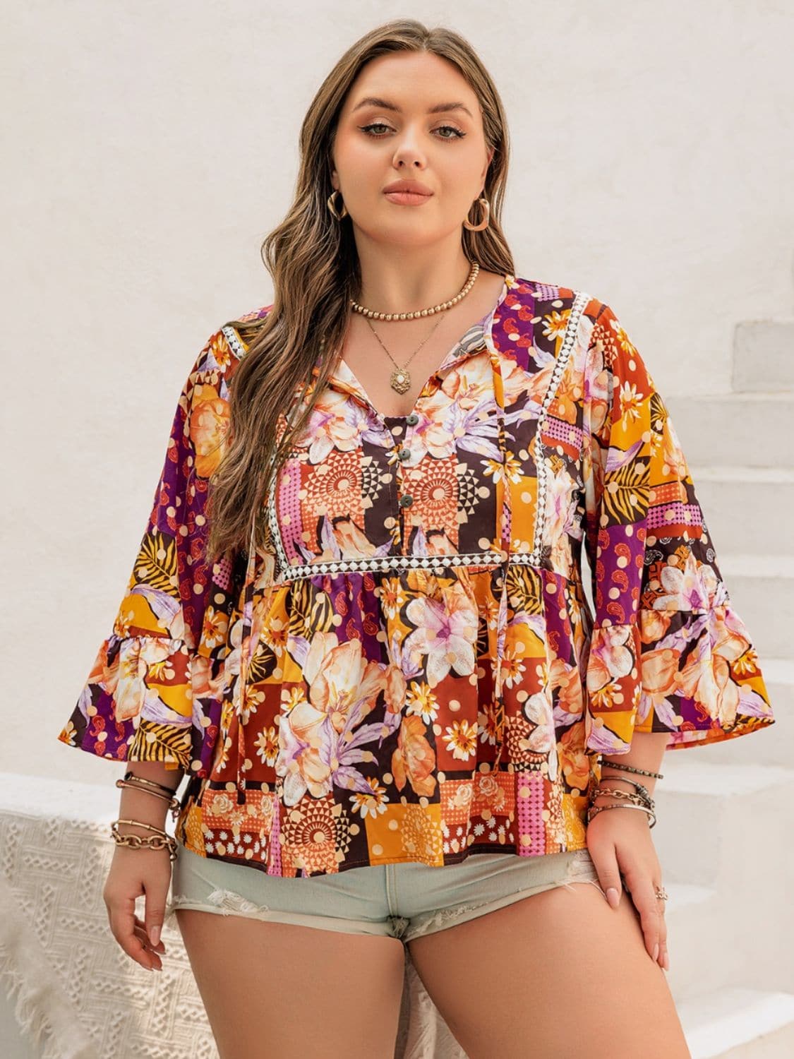 Plus Size Printed Tie Neck Blouse.