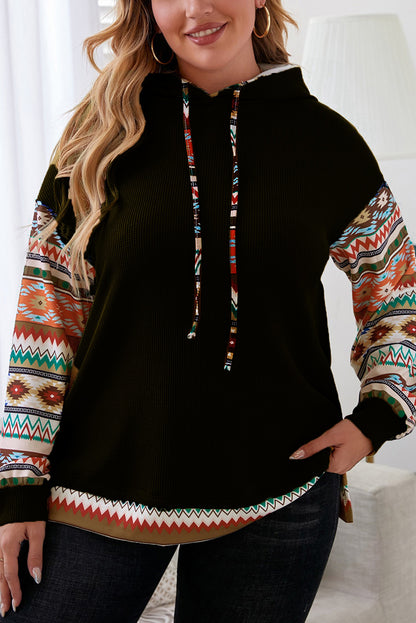 Stylish black hoodie with Aztec patchwork sleeves and drawstring detail