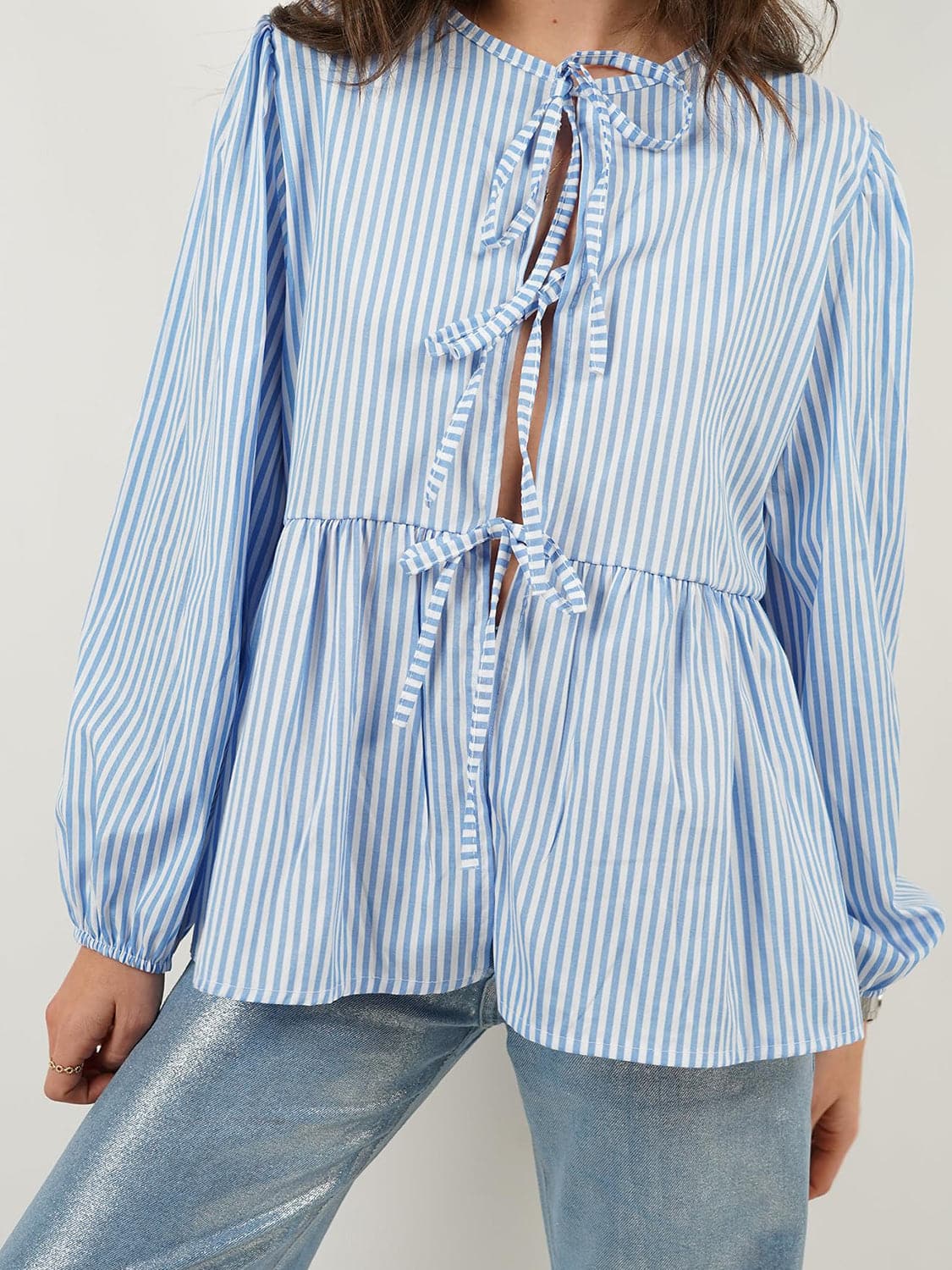 Tied Round Neck Long Sleeve Blouse.