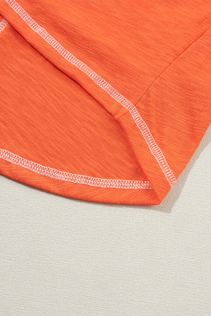 Grapefruit orange exposed seam V-neck tee with contrast trim