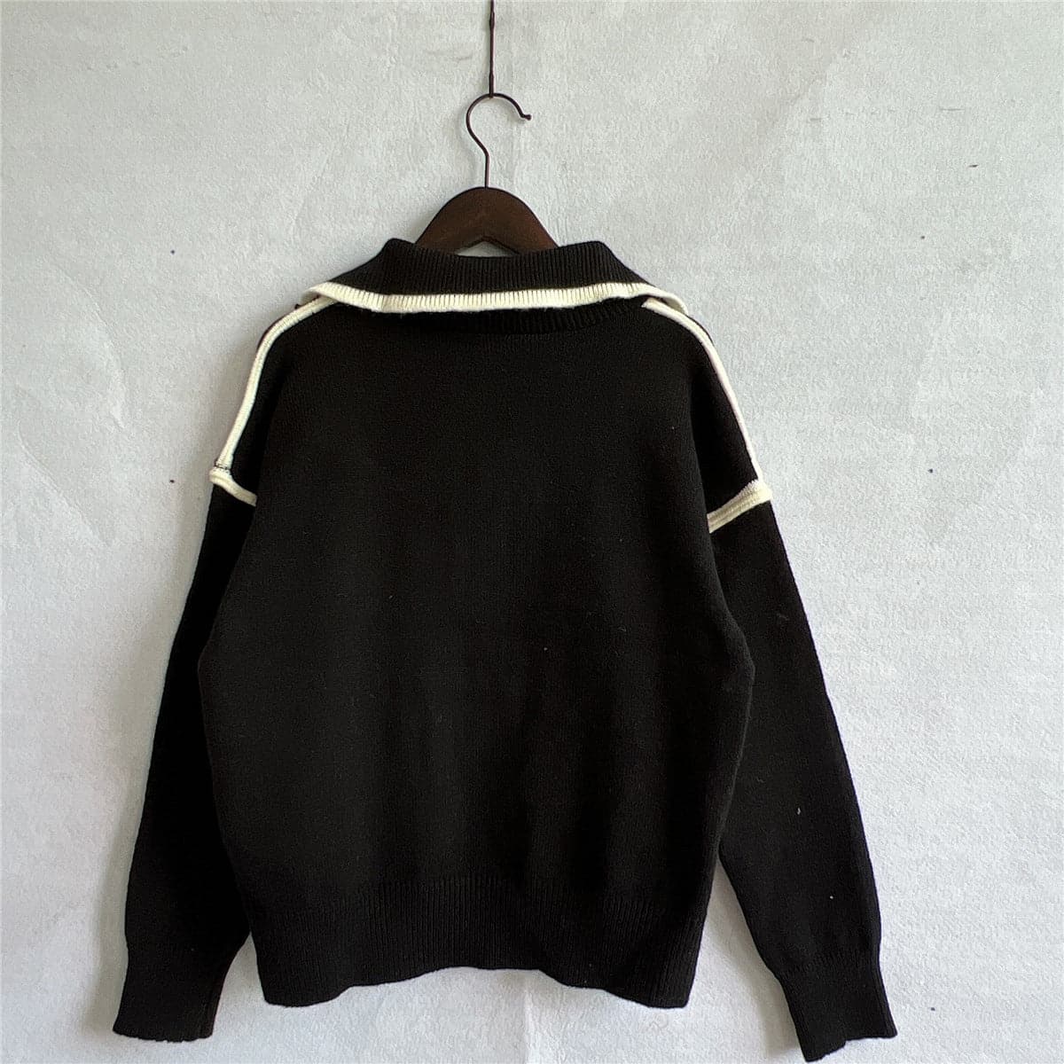 Exposed Seam Half Zip Sweater.