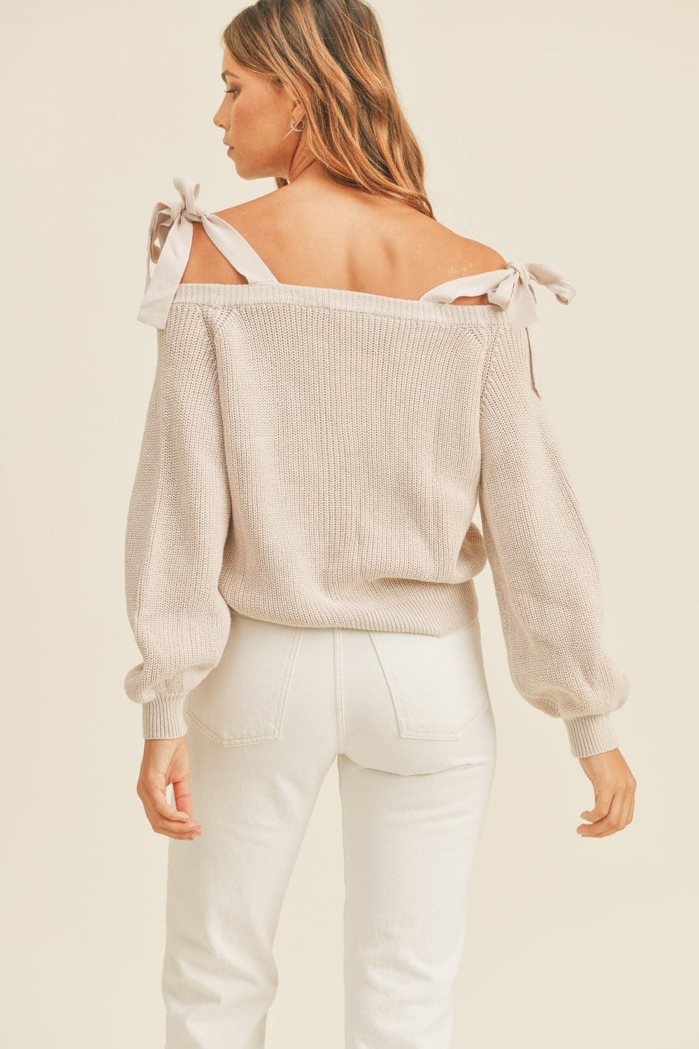 Chic off-shoulder button-down sweater with self-tie straps