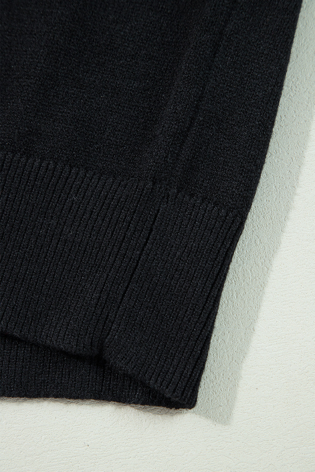 Cozy black "Boo" knitted sweater with ribbed edges for casual style