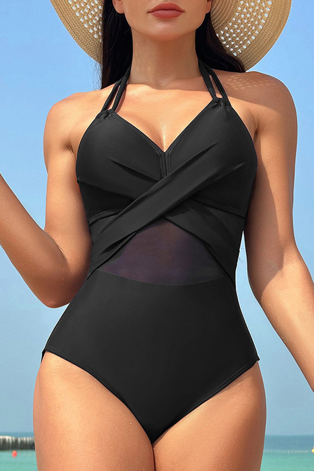 Elegant black halter one-piece swimsuit with mesh inserts